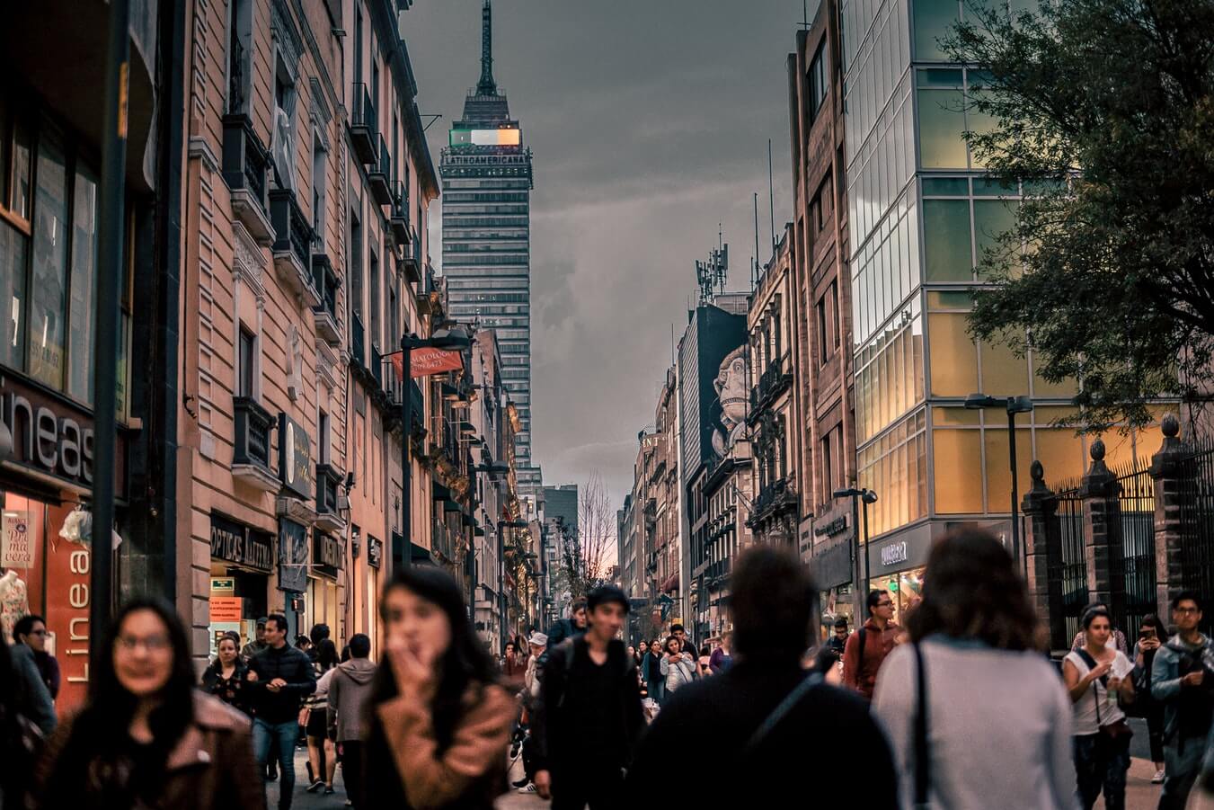 Photo of young professionals walking in street in Mexico City